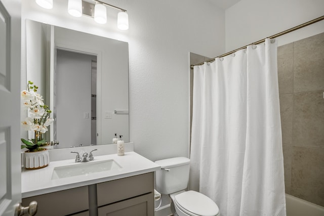 full bathroom with vanity, toilet, and shower / bath combo with shower curtain