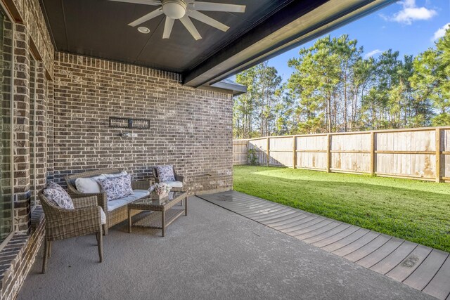 view of patio / terrace with an outdoor living space and ceiling fan