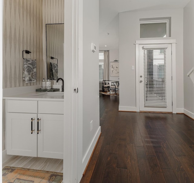 interior space with a wealth of natural light and dark wood-type flooring