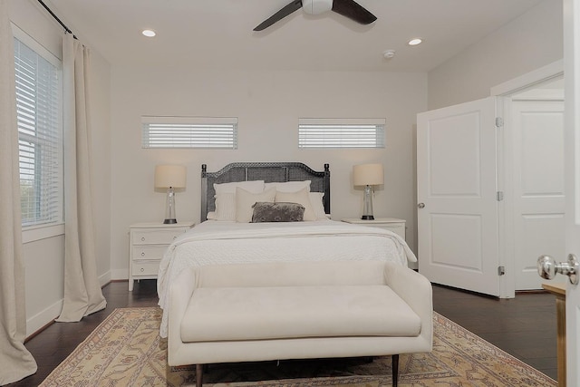 bedroom featuring ceiling fan and dark hardwood / wood-style flooring