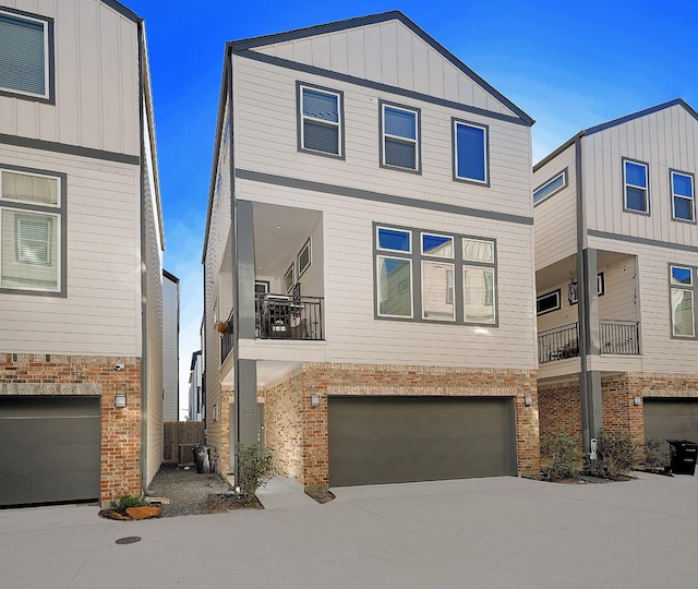 view of front of house with central AC and a garage