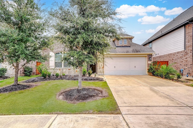 view of front of house with a front lawn and a garage