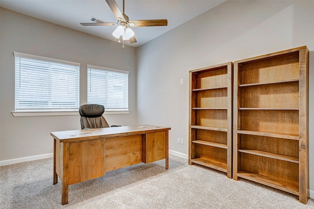 home office featuring ceiling fan, a healthy amount of sunlight, and light carpet