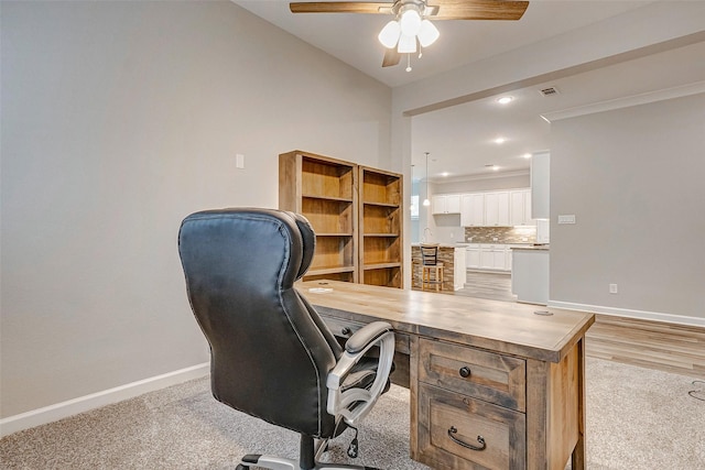 home office with ceiling fan, light colored carpet, and vaulted ceiling