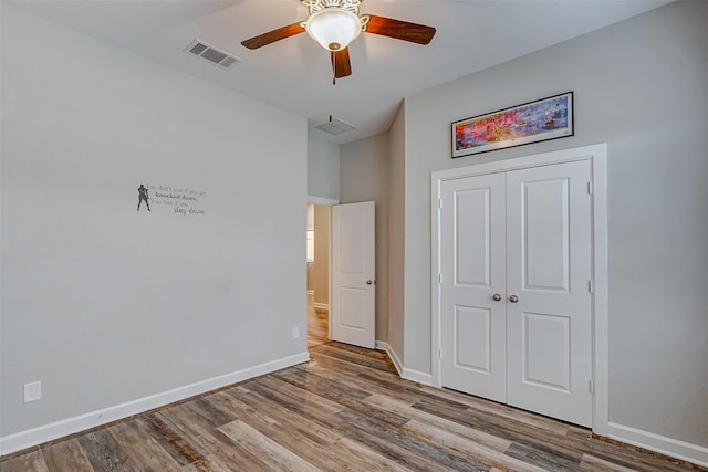 unfurnished bedroom featuring a closet, ceiling fan, and light hardwood / wood-style floors