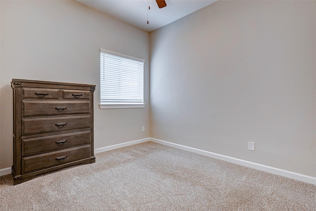 interior space featuring light colored carpet and ceiling fan