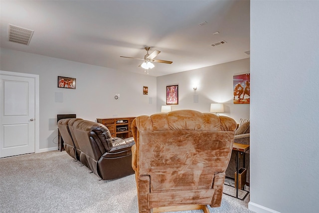 carpeted living room with ceiling fan