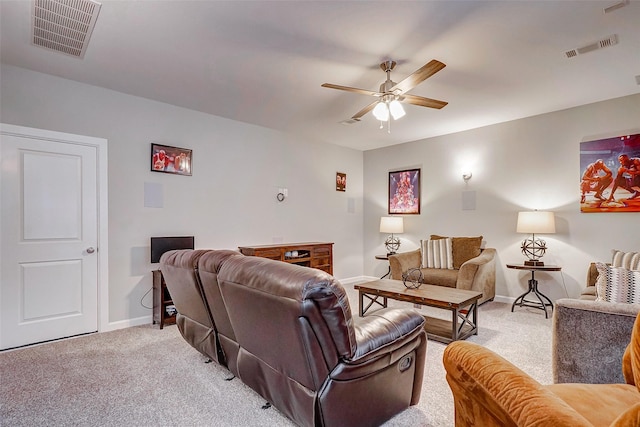 living room featuring ceiling fan and light carpet