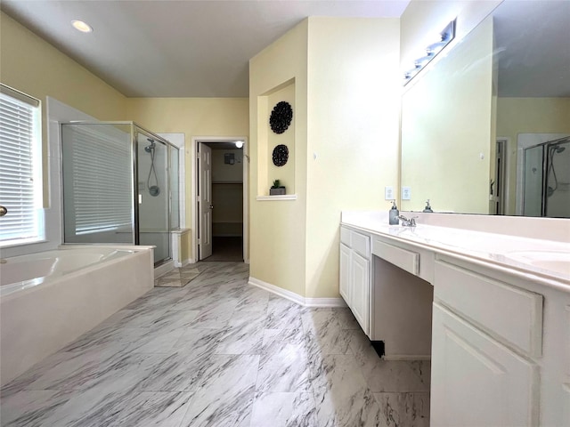 bathroom featuring shower with separate bathtub and vanity