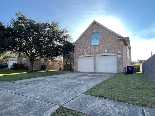 view of side of home with a lawn and a garage