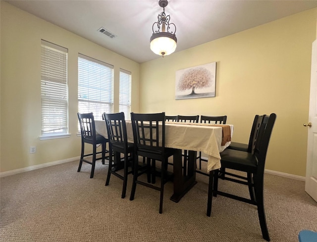 view of carpeted dining space