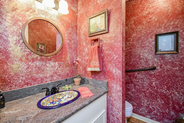 bathroom with vanity and toilet