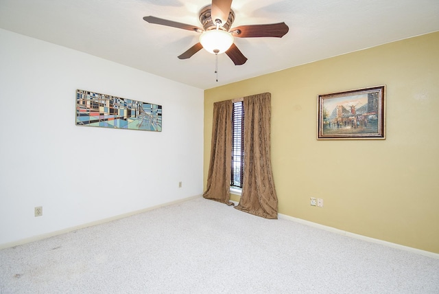 spare room with carpet flooring and ceiling fan