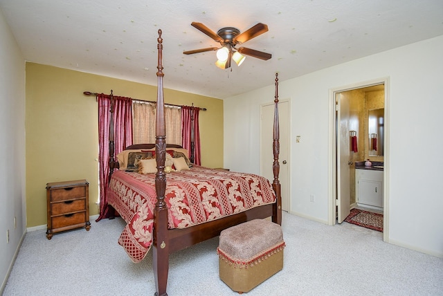 carpeted bedroom with ceiling fan and ensuite bathroom