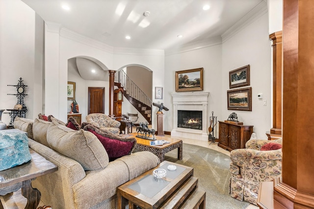 living room featuring decorative columns and crown molding