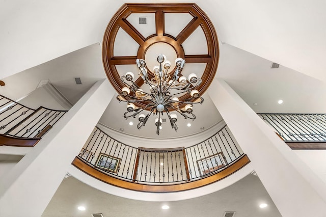 interior details featuring an inviting chandelier