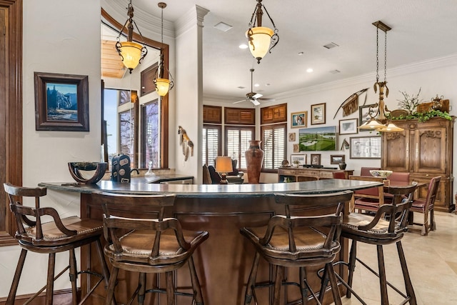 bar with ceiling fan, light tile patterned floors, decorative light fixtures, and ornamental molding