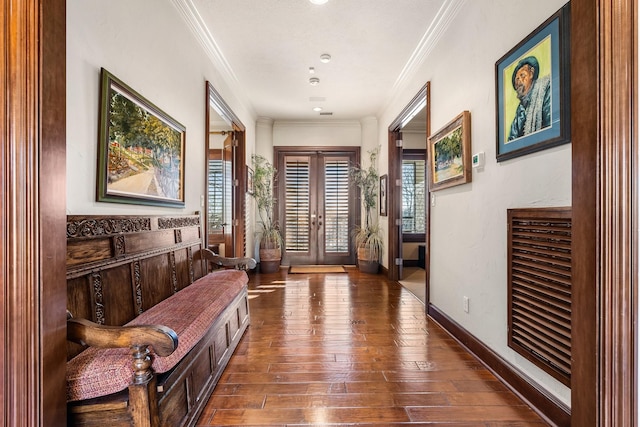 interior space featuring french doors, dark wood-type flooring, and crown molding