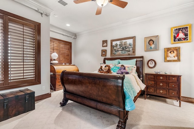 carpeted bedroom with ceiling fan and crown molding