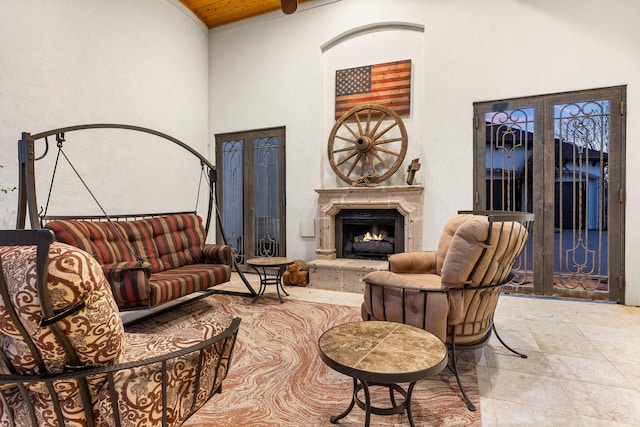 living room with a towering ceiling and wood ceiling