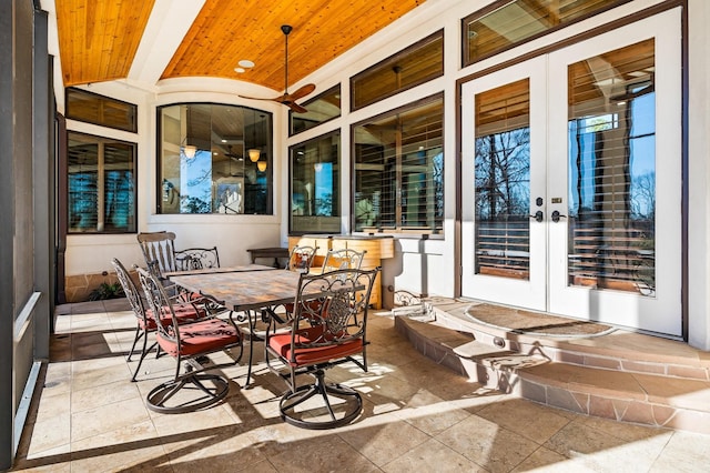 sunroom / solarium with french doors, brick ceiling, and vaulted ceiling