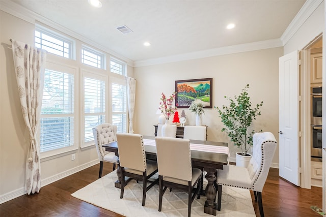 dining space with dark hardwood / wood-style floors and ornamental molding