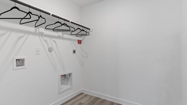 washroom featuring hookup for a gas dryer, wood-type flooring, washer hookup, and hookup for an electric dryer