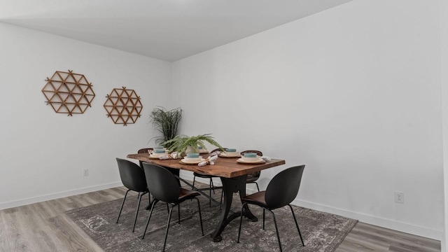 dining room with hardwood / wood-style flooring