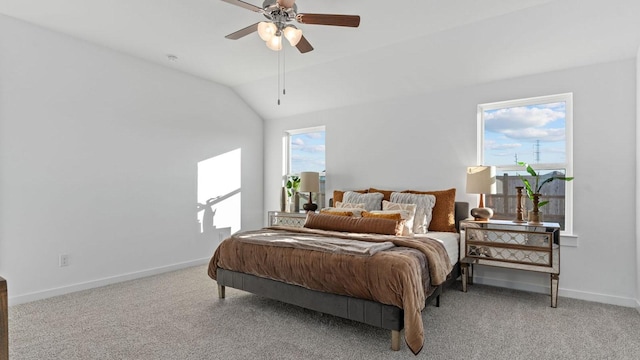 carpeted bedroom featuring vaulted ceiling and ceiling fan