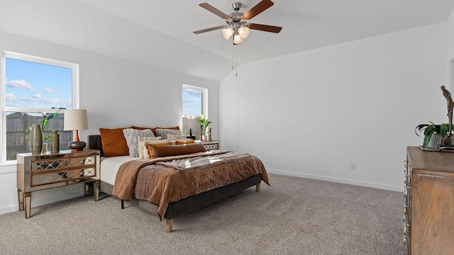 bedroom featuring ceiling fan, light carpet, and vaulted ceiling