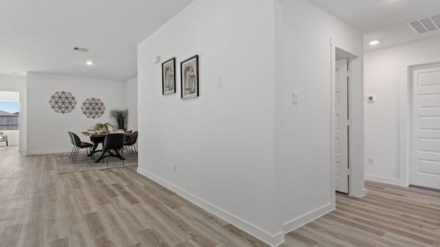 corridor featuring light hardwood / wood-style flooring