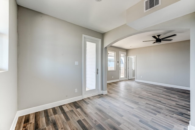 spare room featuring light hardwood / wood-style floors and ceiling fan