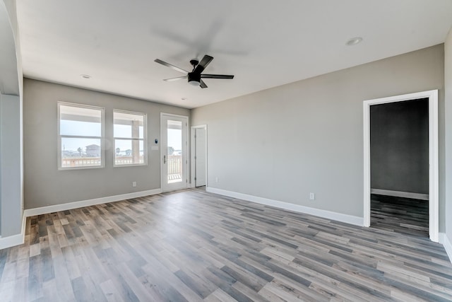 unfurnished room featuring light hardwood / wood-style flooring and ceiling fan