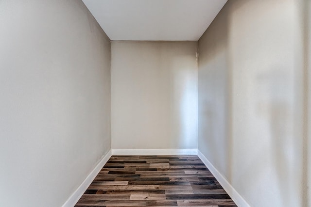 spare room with dark hardwood / wood-style flooring