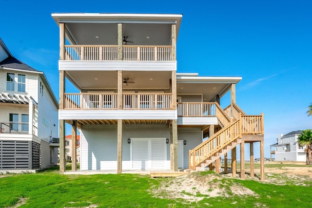 back of house with ceiling fan and a patio area