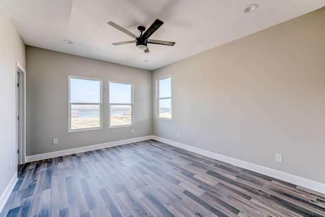 spare room featuring ceiling fan and hardwood / wood-style flooring