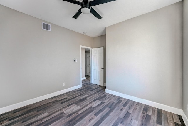 unfurnished bedroom with ceiling fan and dark hardwood / wood-style floors