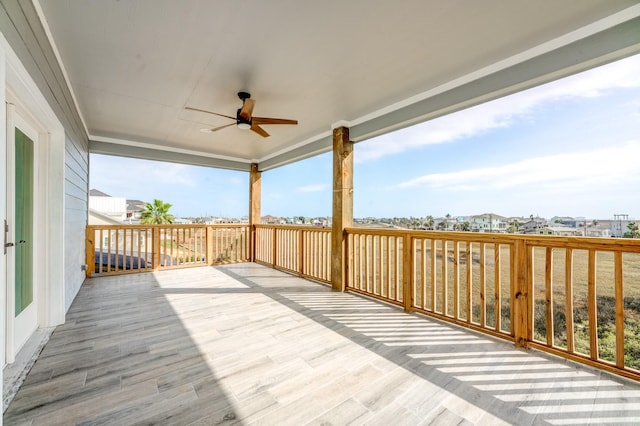 wooden deck with ceiling fan