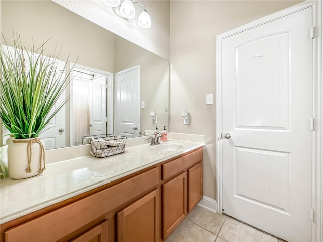 bathroom featuring tile patterned flooring and vanity