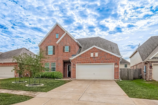 view of front of house with a front lawn and a garage