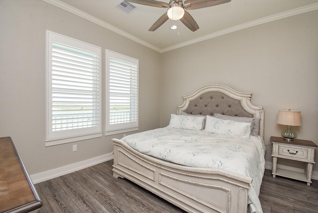 bedroom with crown molding, ceiling fan, and dark wood-type flooring