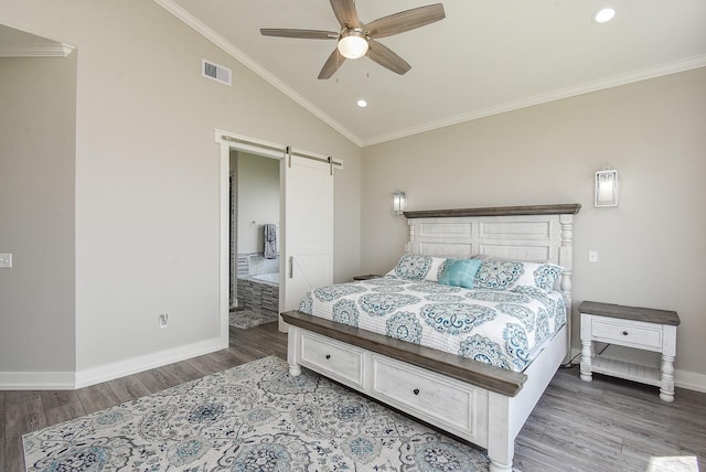 bedroom with a barn door, ceiling fan, wood-type flooring, and lofted ceiling