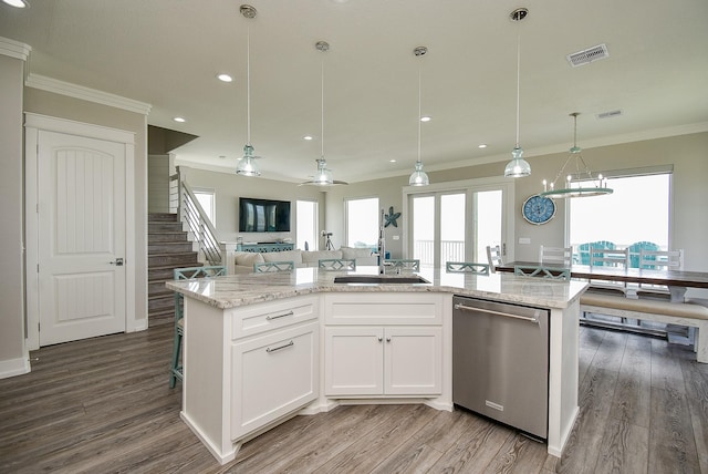 kitchen with stainless steel dishwasher, ceiling fan, sink, white cabinetry, and an island with sink