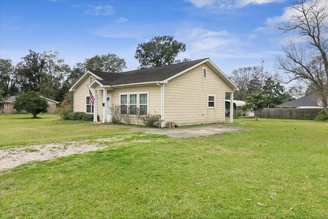 view of front facade with a front yard and a patio area