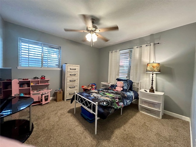 carpeted bedroom featuring ceiling fan