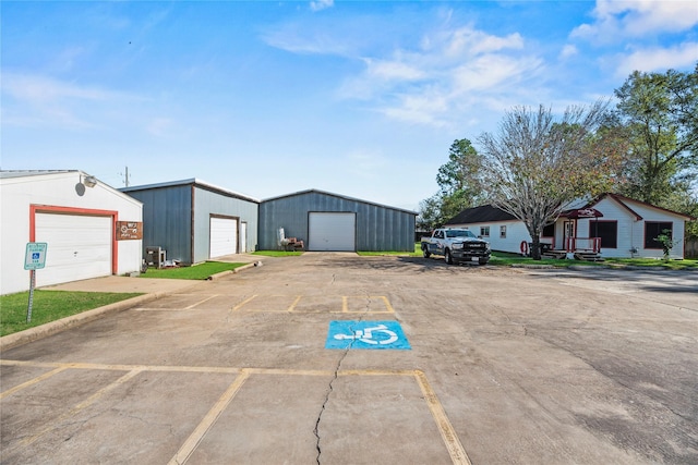 view of vehicle parking with a garage