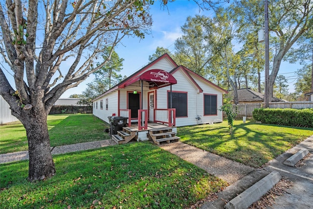 bungalow with a front yard