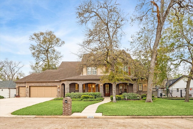 view of front of house with a garage and a front yard