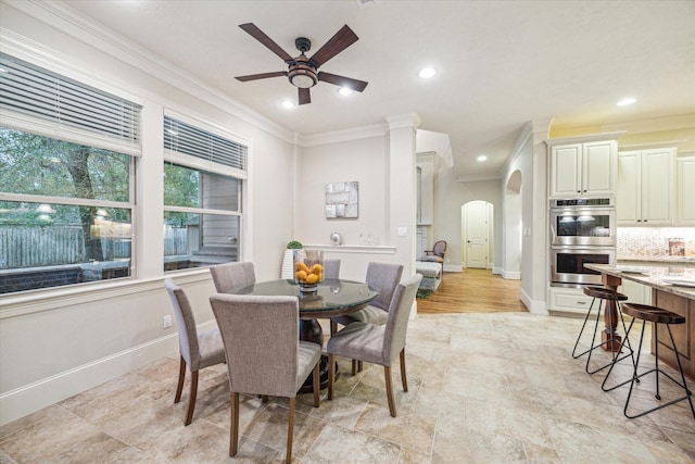 dining room with ceiling fan and ornamental molding