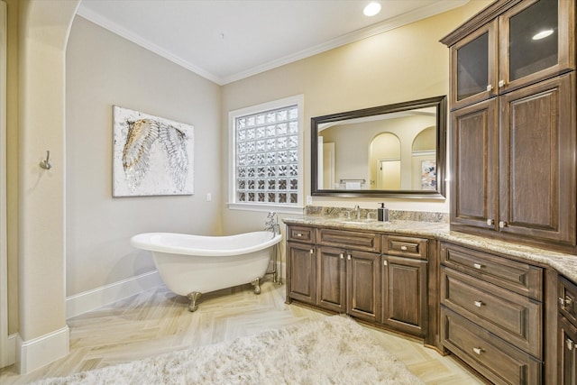 bathroom featuring parquet flooring, ornamental molding, vanity, and a bathing tub